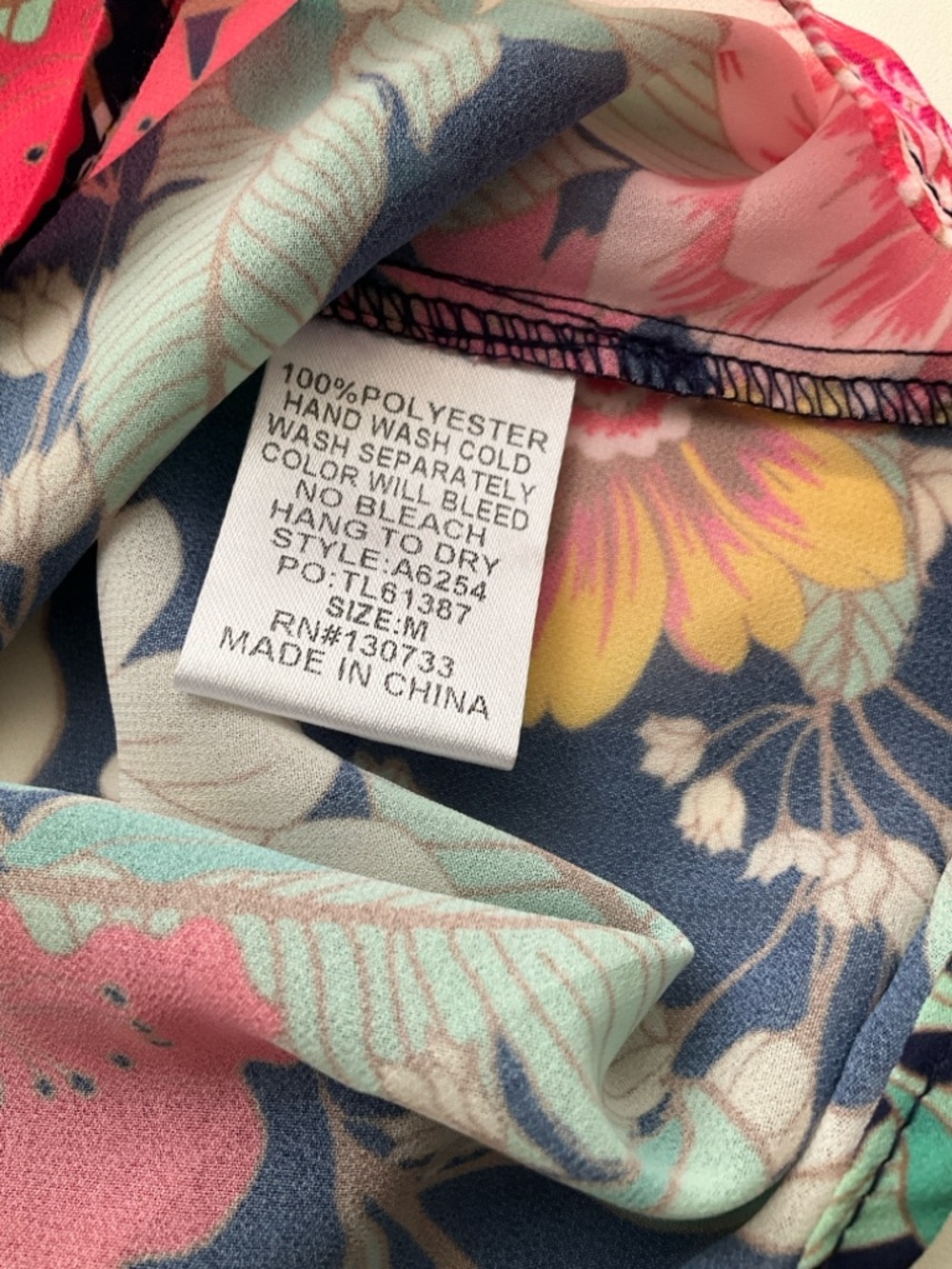 Umgee Medium Navy Floral Off-Shoulder Blouse with Pink, Yellow and Mint Accents - Picture 10 of 11